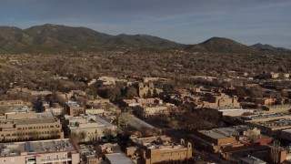 DX0002_132_012 - 5.7K aerial stock footage of the cathedral seen while passing Santa Fe Plaza, Santa Fe, New Mexico