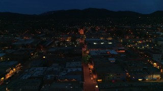 DX0002_132_016 - 5.7K aerial stock footage flyby San Francisco Street with view of cathedral at night, Santa Fe, New Mexico