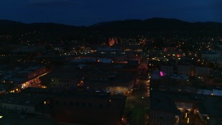DX0002_132_017 - 5.7K aerial stock footage flyby downtown, reveal San Francisco Street leading to cathedral at night, Santa Fe, New Mexico