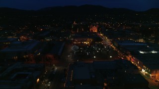 DX0002_132_019 - 5.7K aerial stock footage view of cathedral at night while orbiting Santa Fe Plaza, Santa Fe, New Mexico