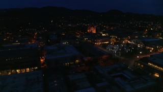 DX0002_132_020 - 5.7K aerial stock footage view of cathedral at night while circling Santa Fe Plaza, Santa Fe, New Mexico