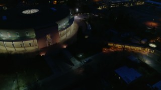 DX0002_132_022 - 5.7K aerial stock footage approach and orbit the New Mexico State Capitol at night, Santa Fe, New Mexico