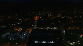 DX0002_132_033 - 5.7K aerial stock footage reverse view of the cathedral and Santa Fe Plaza at night, Santa Fe, New Mexico