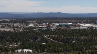 DX0002_133_023 - 5.7K aerial stock footage ascend while slowly passing Los Alamos National Laboratory, New Mexico