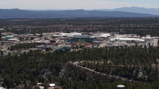 DX0002_133_026 - 5.7K aerial stock footage of a slow approach to the Los Alamos National Laboratory, New Mexico