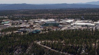 DX0002_133_027 - 5.7K aerial stock footage of slowly passing the Los Alamos National Laboratory, New Mexico