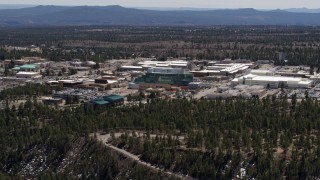 DX0002_133_032 - 5.7K aerial stock footage of flying past the Los Alamos National Laboratory, New Mexico