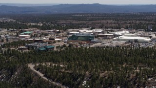 DX0002_133_033 - 5.7K aerial stock footage of flying past and away from the Los Alamos National Laboratory, New Mexico