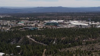 DX0002_133_035 - 5.7K aerial stock footage of slowly flying by the Los Alamos National Laboratory complex, New Mexico