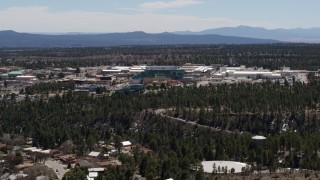 DX0002_133_036 - 5.7K aerial stock footage of slowly passing by the Los Alamos National Laboratory complex, New Mexico