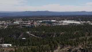 DX0002_133_038 - 5.7K aerial stock footage ascend while flying by the Los Alamos National Laboratory complex, New Mexico