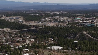 DX0002_133_039 - 5.7K aerial stock footage a bridge spanning the canyon to the Los Alamos National Laboratory complex, New Mexico