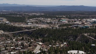 DX0002_133_042 - 5.7K aerial stock footage of a bridge across a canyon and the Los Alamos National Laboratory, New Mexico