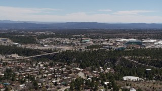 DX0002_134_003 - 5.7K aerial stock footage approach bridge across a canyon and the Los Alamos National Laboratory, New Mexico