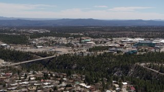 DX0002_134_004 - 5.7K aerial stock footage slow approach to bridge across a canyon and the Los Alamos National Laboratory, New Mexico