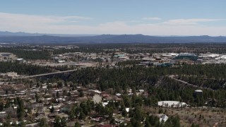 DX0002_134_006 - 5.7K aerial stock footage of bridge across canyon and Los Alamos National Laboratory during descent, New Mexico