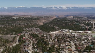 DX0002_134_009 - 5.7K aerial stock footage distant mountains seen from neighborhoods near mesas and canyons in Los Alamos, New Mexico