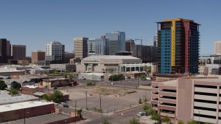 DX0002_136_004 - 5.7K aerial stock footage of orbiting the arena near condo complex in Downtown Phoenix, Arizona