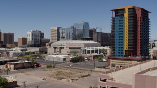 DX0002_136_005 - 5.7K aerial stock footage of flying by the arena to reveal condo complex in Downtown Phoenix, Arizona