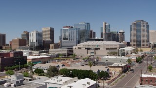 DX0002_136_007 - 5.7K aerial stock footage of flying away from the arena and office buildings in Downtown Phoenix, Arizona