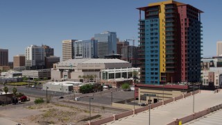 DX0002_136_009 - 5.7K aerial stock footage of flying away from the arena and reveal condo complex in Downtown Phoenix, Arizona