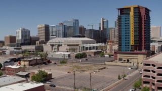 DX0002_136_016 - 5.7K aerial stock footage of approaching the arena and condo complex in Downtown Phoenix, Arizona