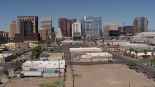 DX0002_136_026 - 5.7K aerial stock footage of a reverse view of tall office buildings in Downtown Phoenix, Arizona