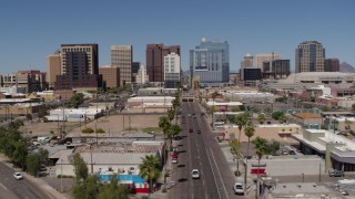 DX0002_136_027 - 5.7K aerial stock footage of flying by Central Avenue focused on tall office buildings, Downtown Phoenix, Arizona