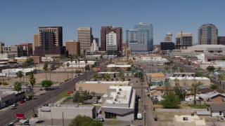 DX0002_136_028 - 5.7K aerial stock footage of passing by Central Avenue focused on tall office buildings, Downtown Phoenix, Arizona