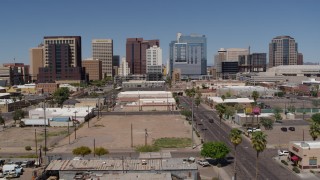 DX0002_136_034 - 5.7K aerial stock footage flyby and away from high-rise office buildings, seen from Central Avenue, Downtown Phoenix, Arizona