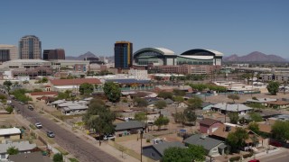 DX0002_136_036 - 5.7K aerial stock footage of a view of a condominium complex and baseball stadium, Downtown Phoenix, Arizona