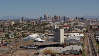 DX0002_136_048 - 5.7K stock footage aerial video of a wide view of the city's skyline, reveal grain elevator in Downtown Phoenix, Arizona