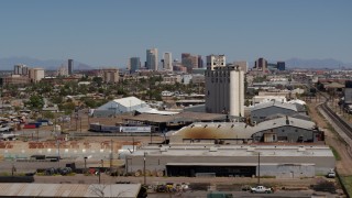 DX0002_136_049 - 5.7K aerial stock footage of the city's skyline seen from a grain elevator in Downtown Phoenix, Arizona
