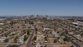 DX0002_137_005 - 5.7K aerial stock footage of a wide view of urban neighborhoods and the city's skyline in Downtown Phoenix, Arizona