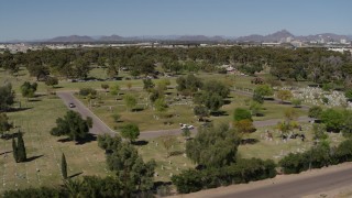 DX0002_137_016 - 5.7K aerial stock footage of flying by a cemetery in Phoenix, Arizona