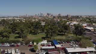 DX0002_137_019 - 5.7K aerial stock footage of a wide view of the city's skyline while approaching cemetery in Downtown Phoenix, Arizona