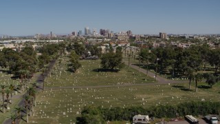 DX0002_137_021 - 5.7K aerial stock footage of a reverse view of the city's skyline from cemetery in Downtown Phoenix, Arizona