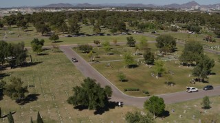 DX0002_137_022 - 5.7K aerial stock footage of orbiting a cemetery in Phoenix, Arizona