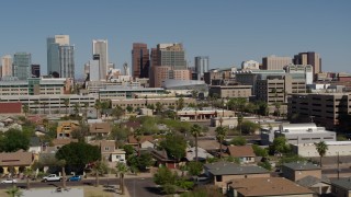 DX0002_137_032 - 5.7K stock footage aerial video slowly flying past high-rise office buildings in Downtown Phoenix, Arizona
