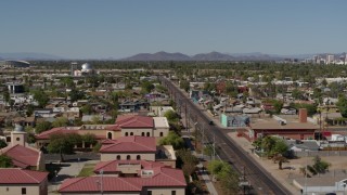 DX0002_137_043 - 5.7K aerial stock footage flying by 15th Avenue and residential neighborhood in Phoenix, Arizona