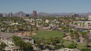 DX0002_137_045 - 5.7K aerial stock footage BMO Tower seen while flying by University Park in Phoenix, Arizona
