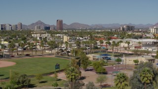 DX0002_137_047 - 5.7K aerial stock footage a view of BMO Tower seen while passing University Park in Phoenix, Arizona