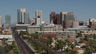 DX0002_137_049 - 5.7K aerial stock footage of tall office buildings seen from Van Buren Street in Downtown Phoenix, Arizona