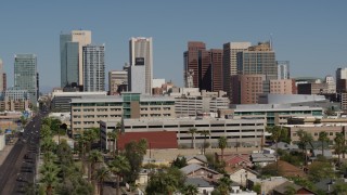 DX0002_137_051 - 5.7K aerial stock footage of towering office buildings seen while flying near Van Buren Street in Downtown Phoenix, Arizona