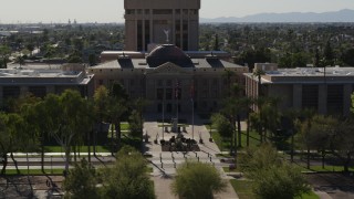 DX0002_137_056 - 5.7K aerial stock footage of orbiting the front of Arizona State Capitol building in Phoenix, Arizona
