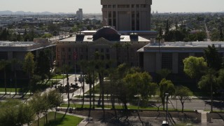 DX0002_137_058 - 5.7K aerial stock footage of circling the front of Arizona State Capitol building in Phoenix, Arizona