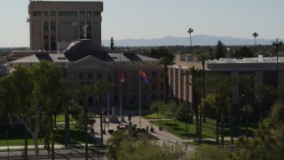 DX0002_137_062 - 5.7K aerial stock footage of ascending from trees, reveal the Arizona State Capitol building in Phoenix, Arizona