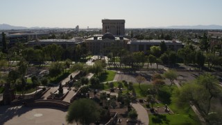 DX0002_138_003 - 5.7K aerial stock footage flyby plaza while focused the Arizona State Capitol building in Phoenix, Arizona