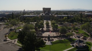 DX0002_138_005 - 5.7K aerial stock footage reverse view of plaza and the Arizona State Capitol building in Phoenix, Arizona