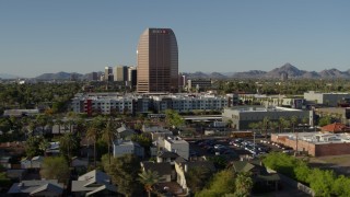 DX0002_138_029 - 5.7K aerial stock footage of a wide orbit of the BMO Tower high-rise office building in Phoenix, Arizona